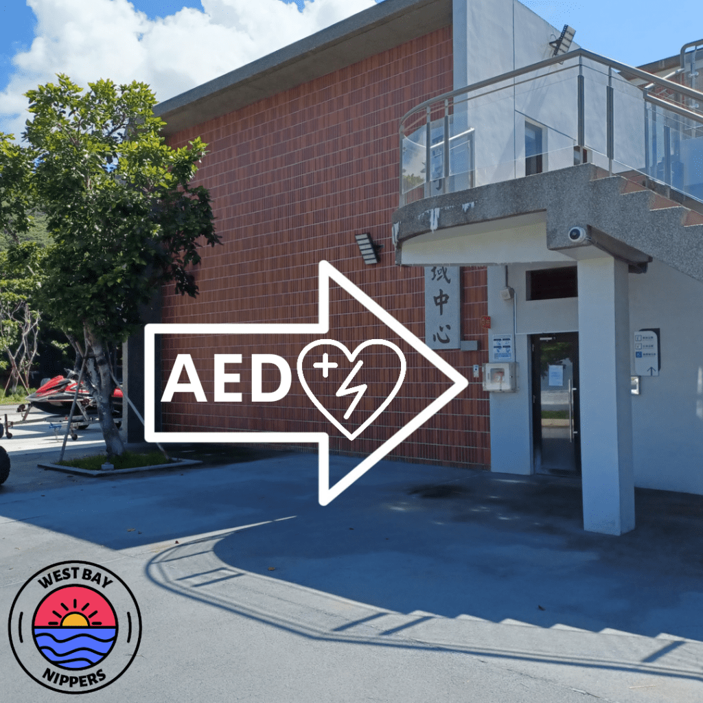 Direction to the Automated external Defibrillator (AED) outside the West Bay Nippers surf lifesaving clubhouse