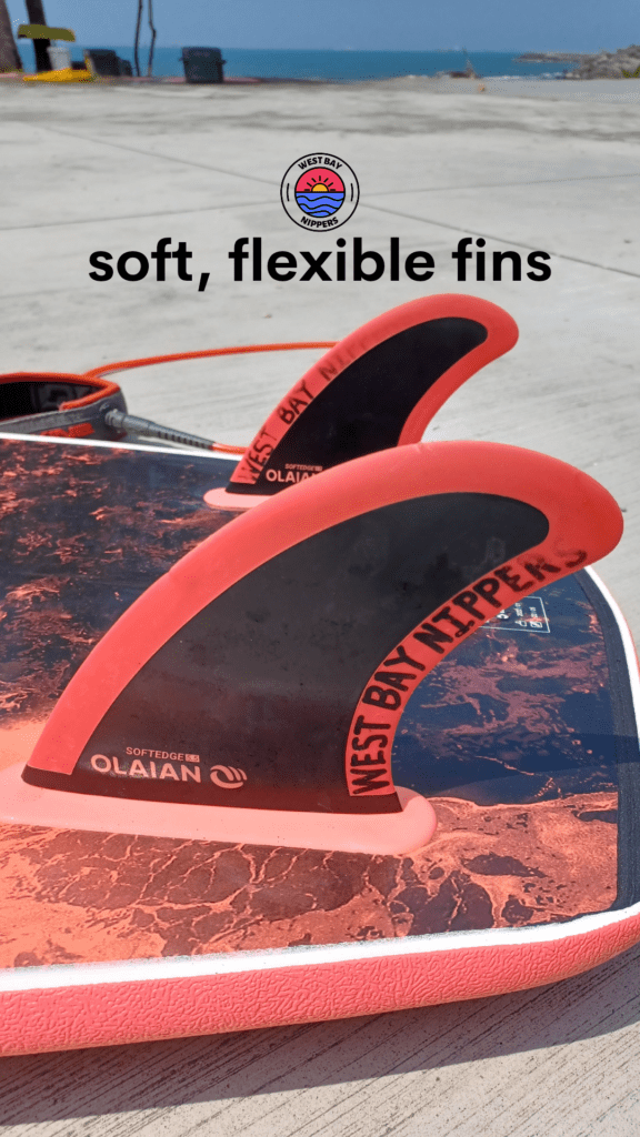 Soft flexible fins on a softtop surfboard.