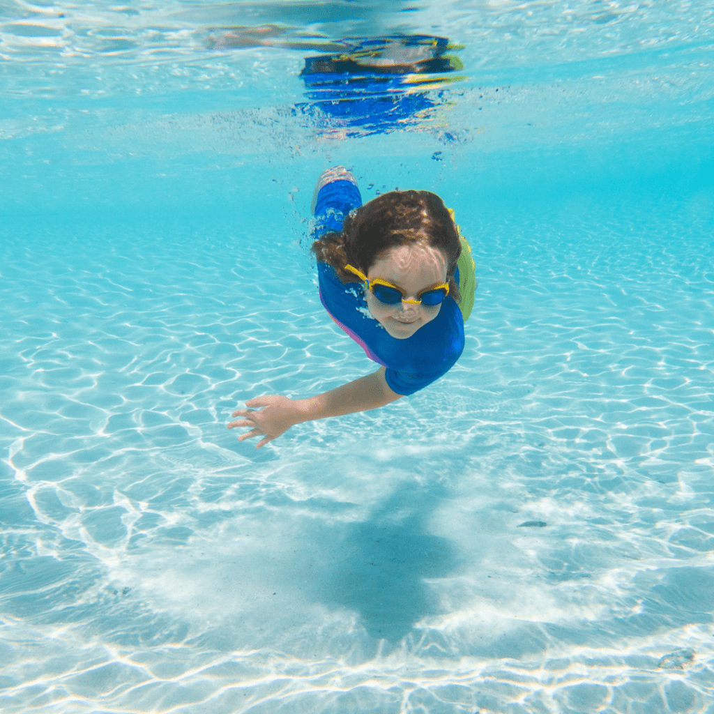 West Bay Nipper swimming under the water at the beach